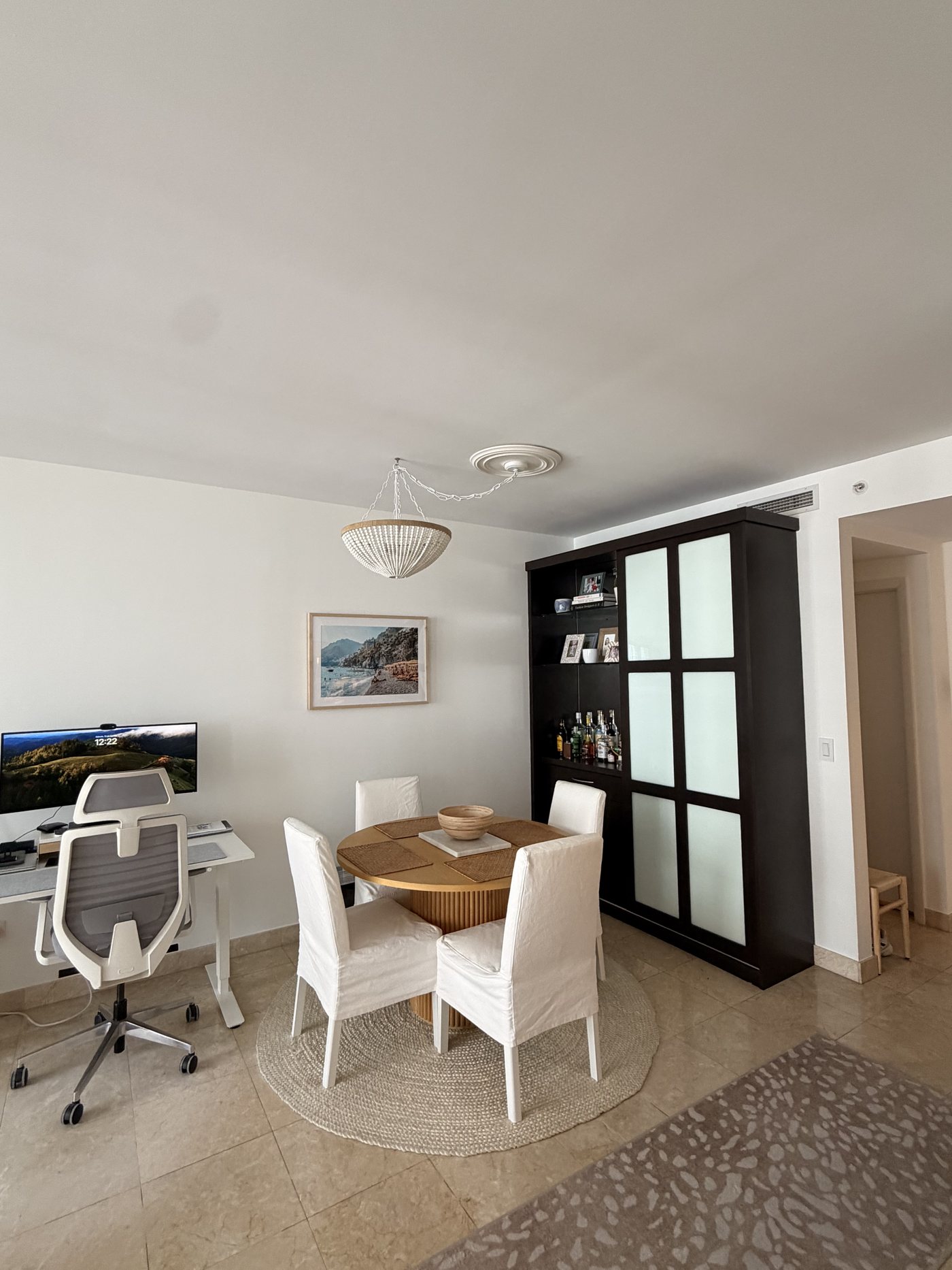 Dining nook with round table and bar cabinet