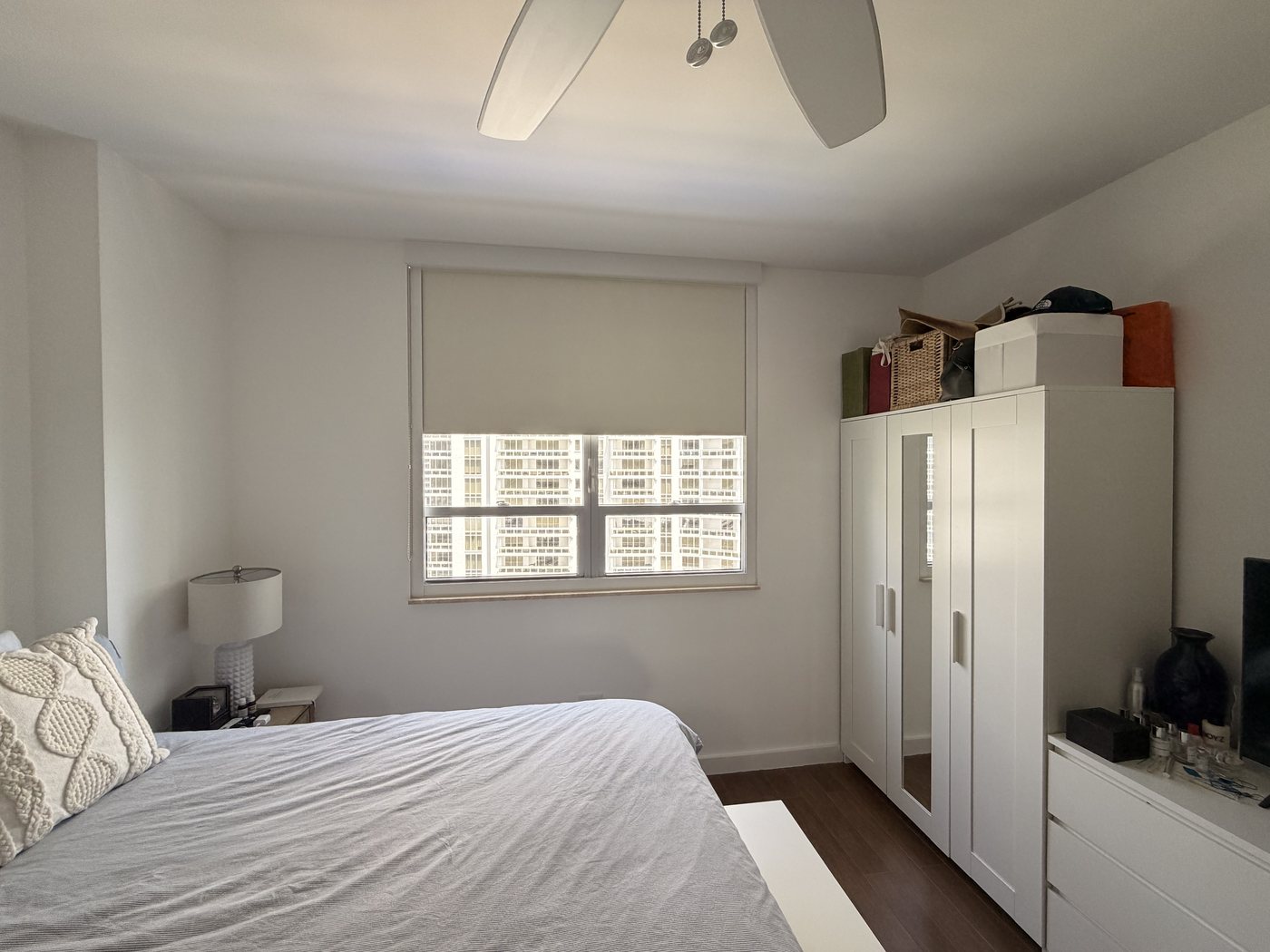 Bedroom furnished with bed, wardrobe, and dresser