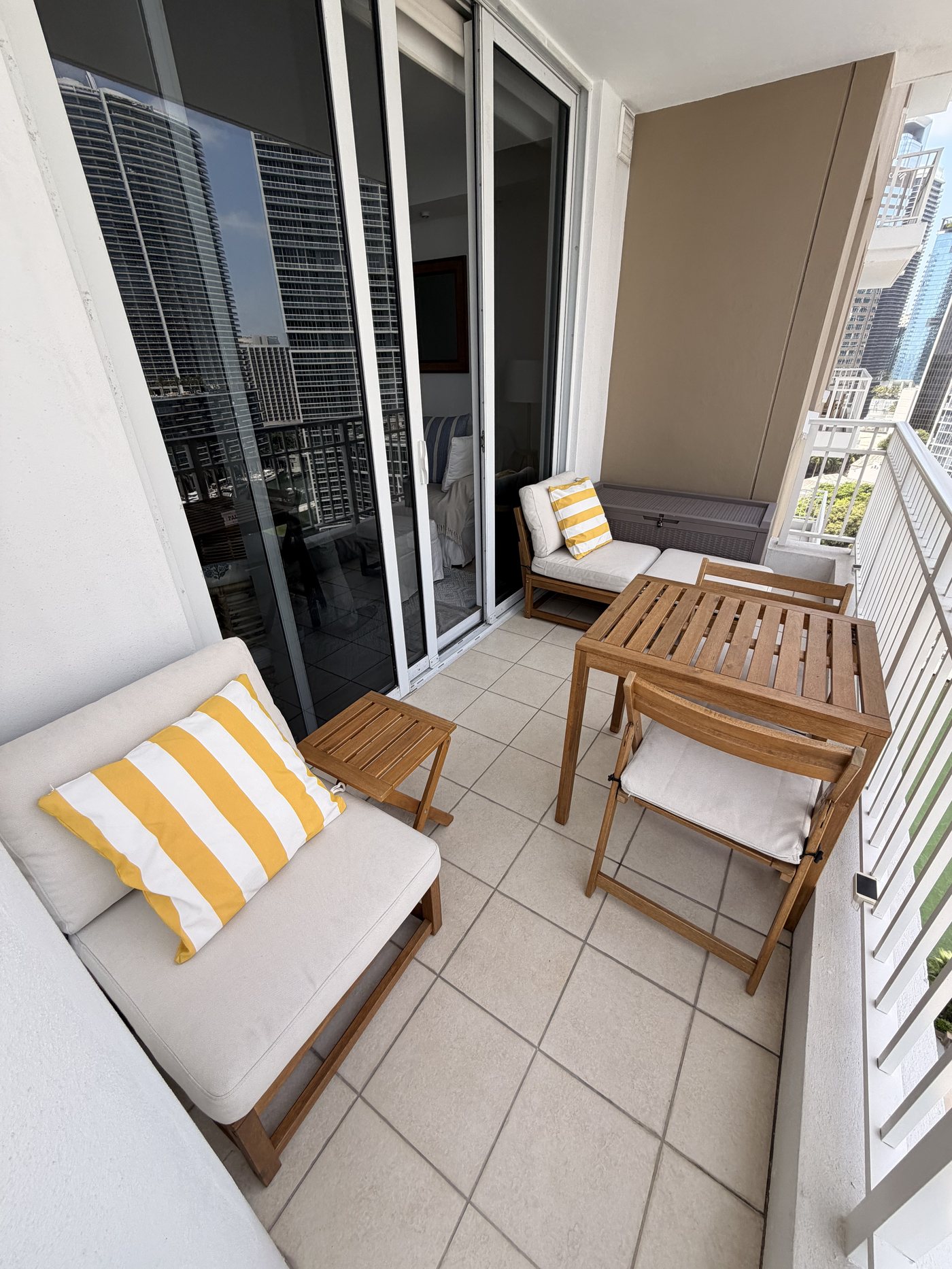 Balcony furnished with outdoor seating and dining table