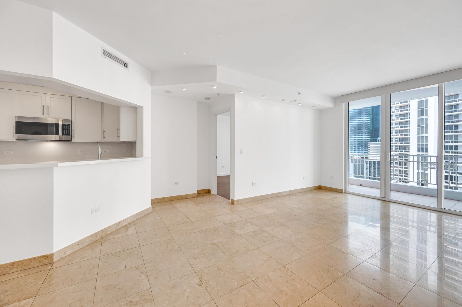 Living area with floor-to-ceiling windows and city view